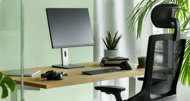 fauteuil ergonomique ergotopia nextback avec un bureau assis debout et un ordinateur